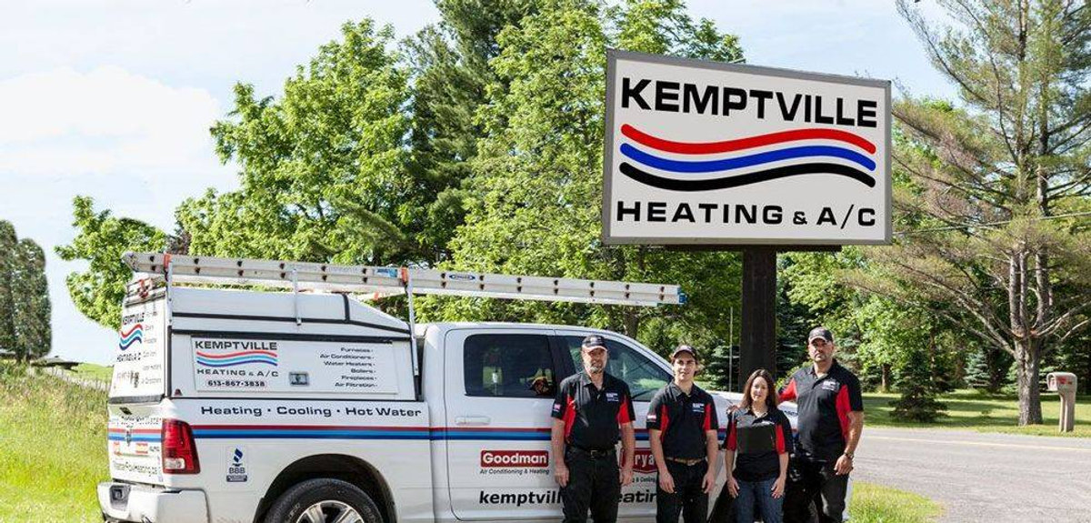 The Kemptville Heating and AC team beside their service truck and company sign